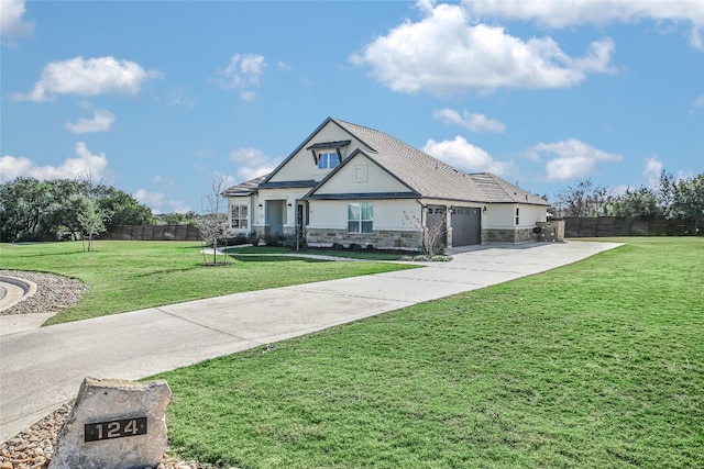 craftsman house with a garage and a front yard