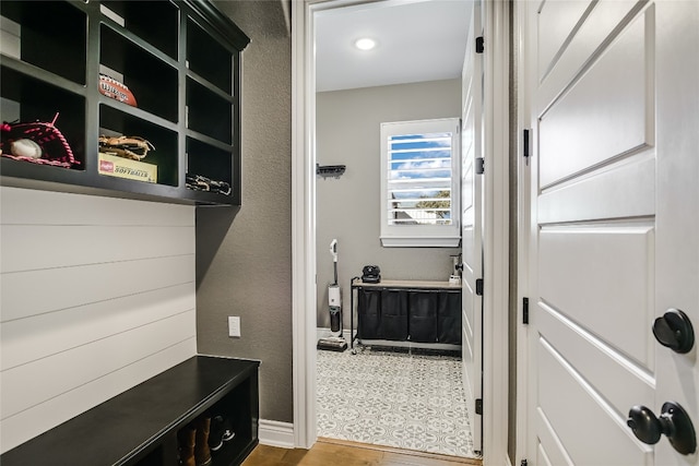 mudroom with wood-type flooring