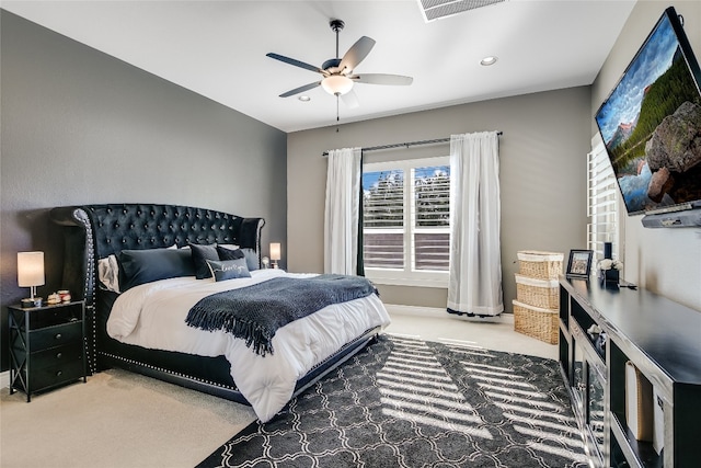 carpeted bedroom with ceiling fan