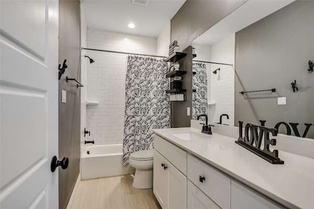 full bathroom with toilet, shower / bath combo, hardwood / wood-style flooring, and vanity