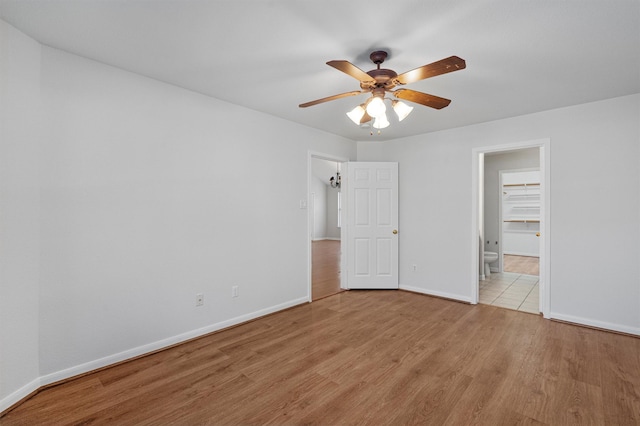 unfurnished bedroom featuring ceiling fan and light hardwood / wood-style floors