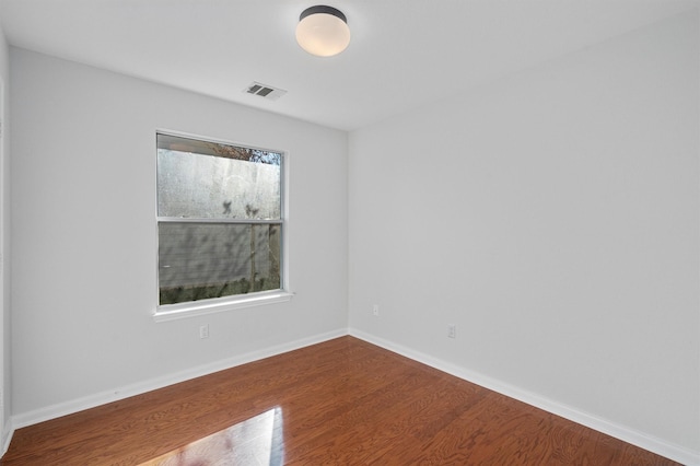 empty room featuring hardwood / wood-style floors