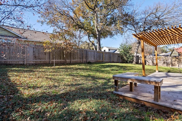 view of yard with a wooden deck and a pergola