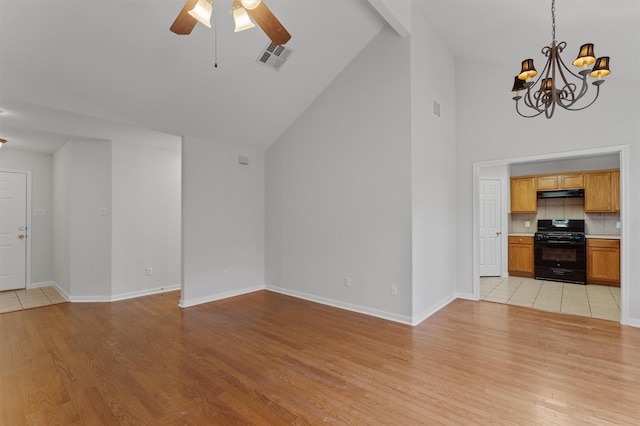 unfurnished living room featuring high vaulted ceiling, ceiling fan with notable chandelier, and light hardwood / wood-style flooring