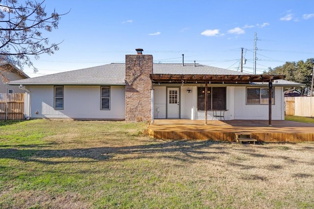 back of house with a yard and a deck