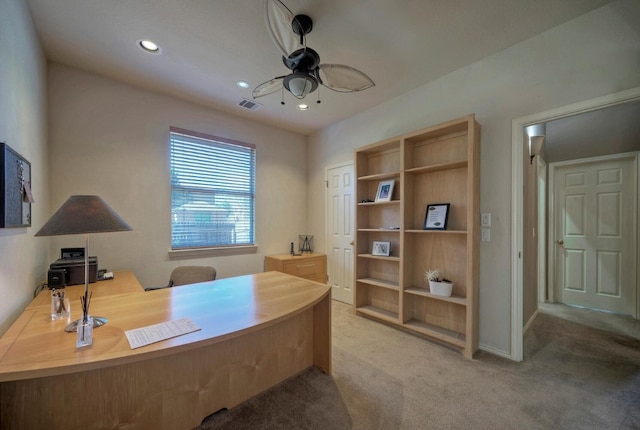 home office with ceiling fan and light colored carpet