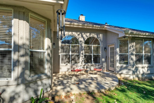 back of property with a patio