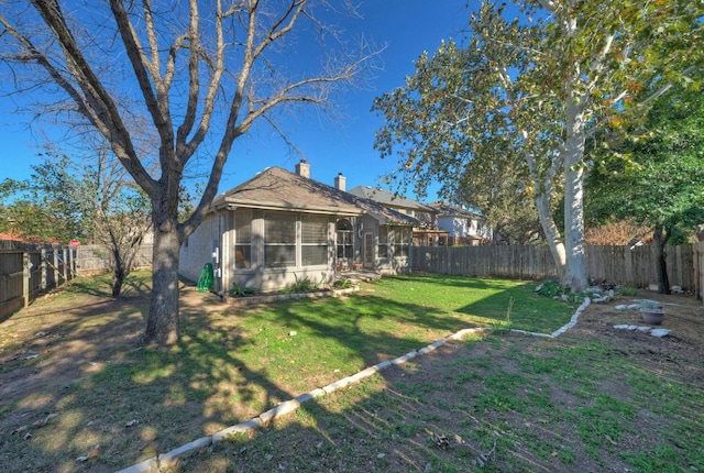 view of yard featuring a sunroom