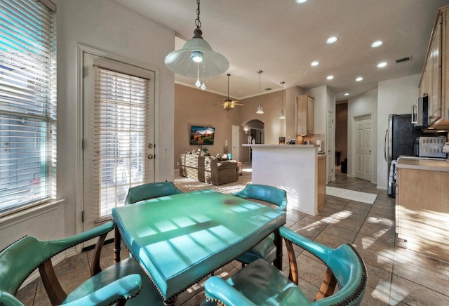 tiled dining room with ceiling fan