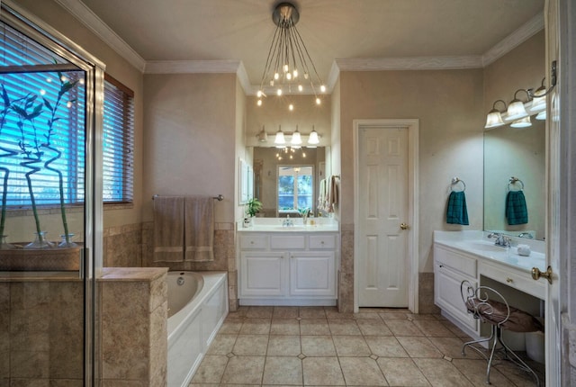 bathroom with vanity, a tub to relax in, a wealth of natural light, and ornamental molding