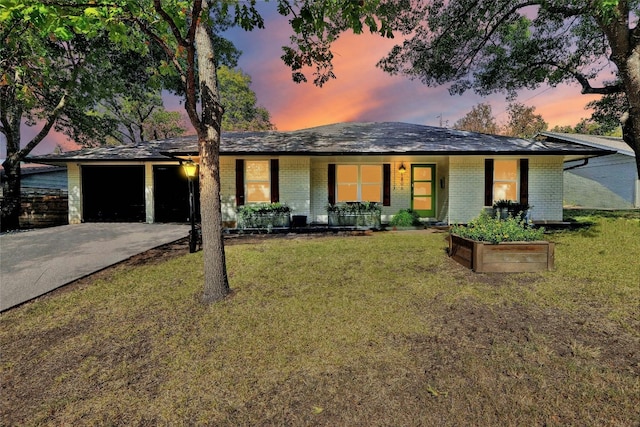 ranch-style house featuring a lawn