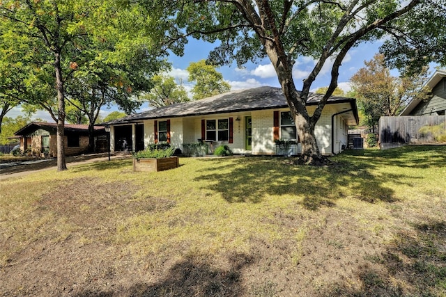 single story home featuring central air condition unit and a front lawn