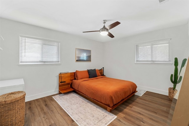 bedroom with wood-type flooring and ceiling fan