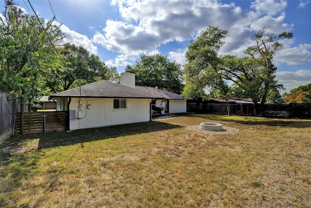 view of yard with a fire pit