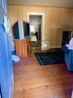 bedroom featuring wooden walls