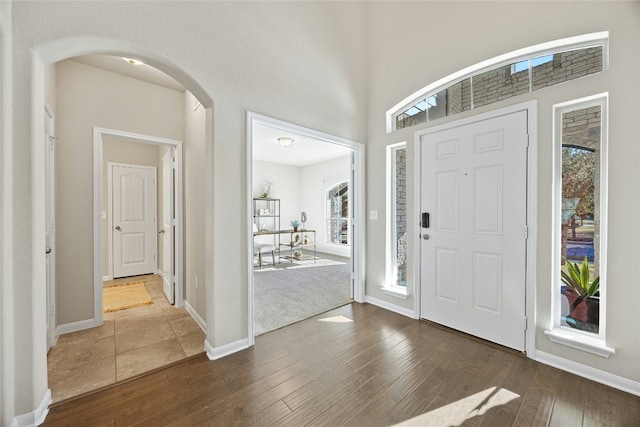 entrance foyer with dark hardwood / wood-style floors