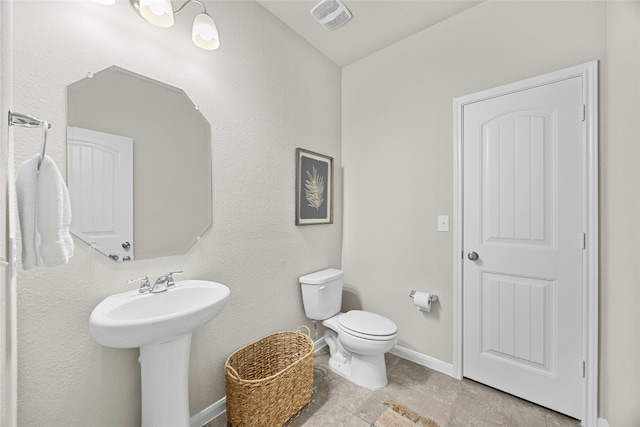 bathroom with toilet and sink