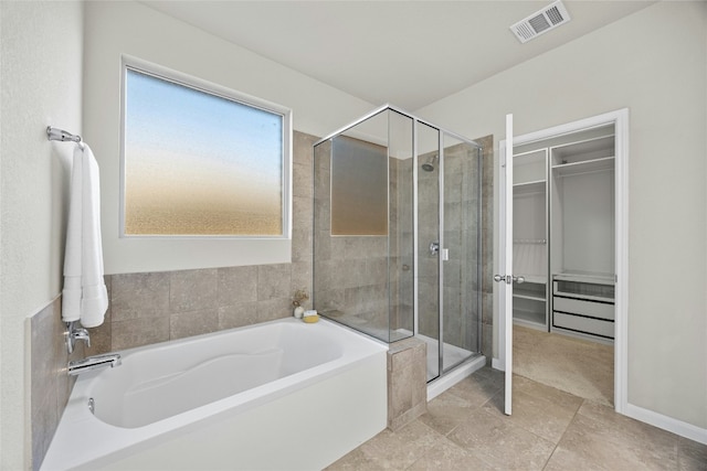 bathroom with shower with separate bathtub