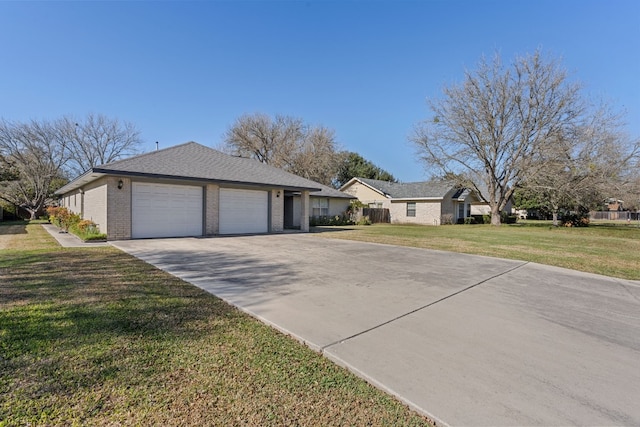 ranch-style home featuring a garage and a front yard