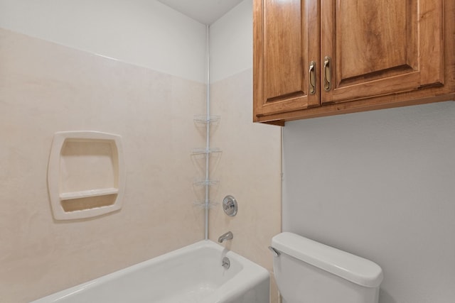 bathroom with toilet and bathtub / shower combination