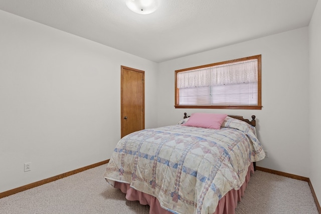 bedroom featuring light colored carpet