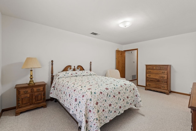 bedroom featuring light carpet