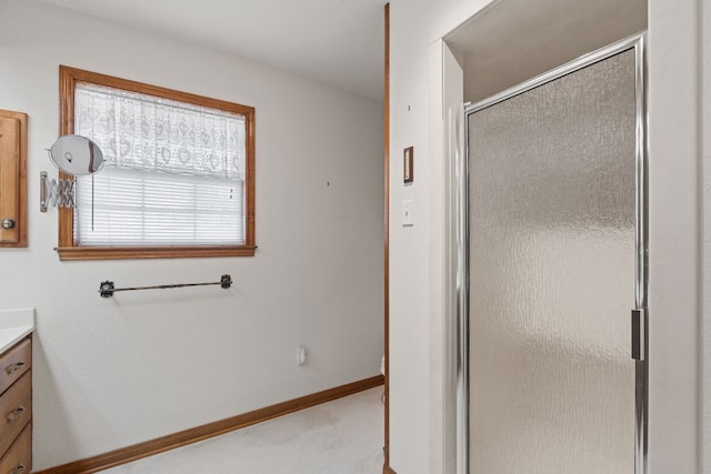 bathroom with vanity and an enclosed shower