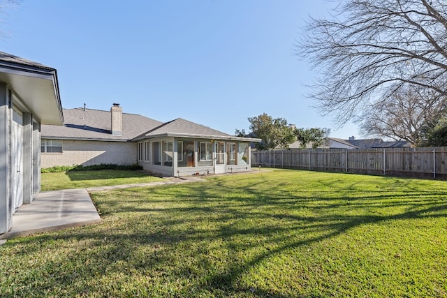 view of yard featuring a sunroom