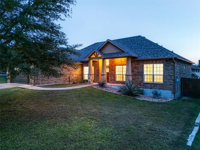 craftsman-style house featuring a lawn