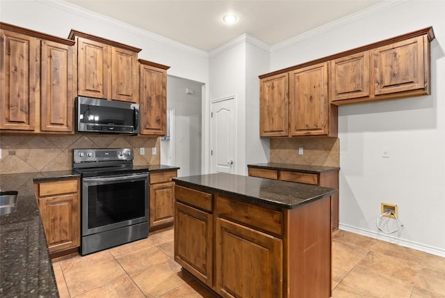 kitchen with appliances with stainless steel finishes, dark stone counters, tasteful backsplash, and ornamental molding