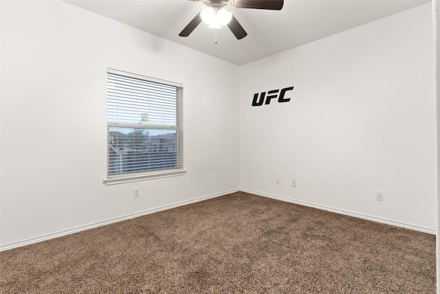 spare room featuring ceiling fan and carpet floors