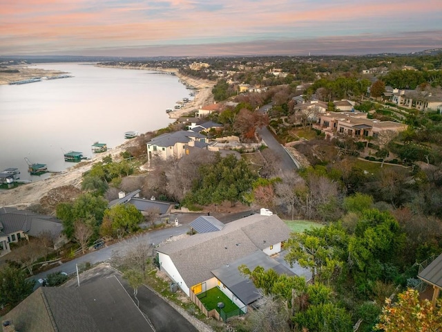 aerial view at dusk with a water view