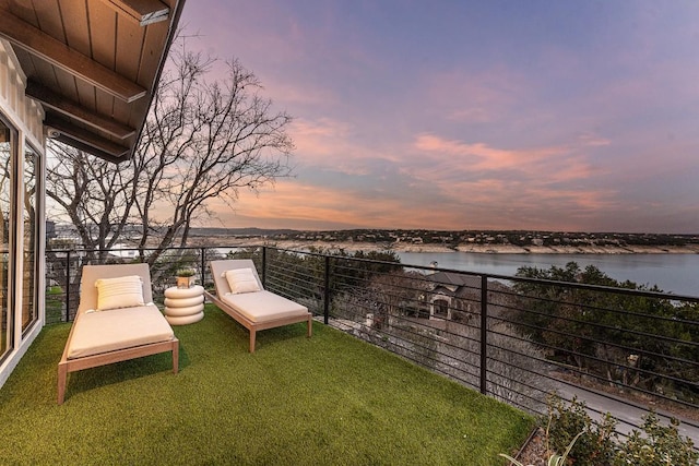 balcony at dusk with a water view