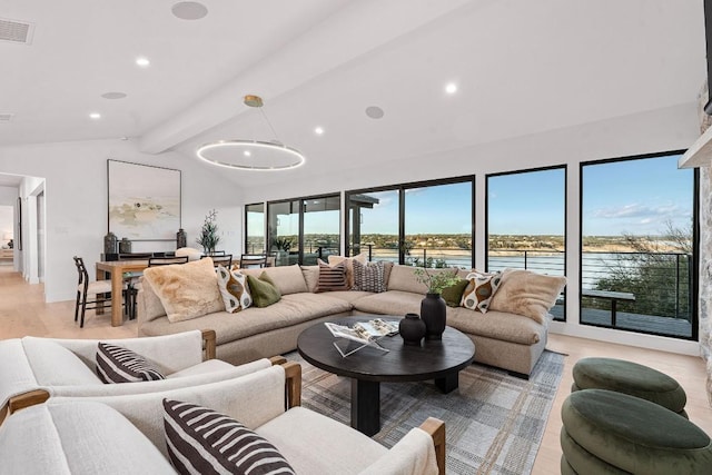 living room with vaulted ceiling with beams, light hardwood / wood-style flooring, and a water view