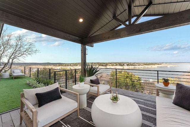 view of patio with a water view, a balcony, and an outdoor hangout area