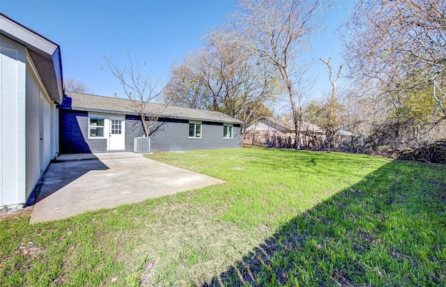 view of yard with a patio and central AC