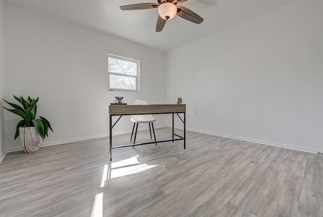 office space featuring ceiling fan and light hardwood / wood-style flooring