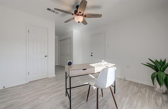 dining area featuring light hardwood / wood-style flooring and ceiling fan