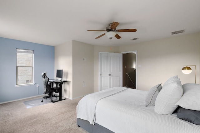 carpeted bedroom featuring ceiling fan