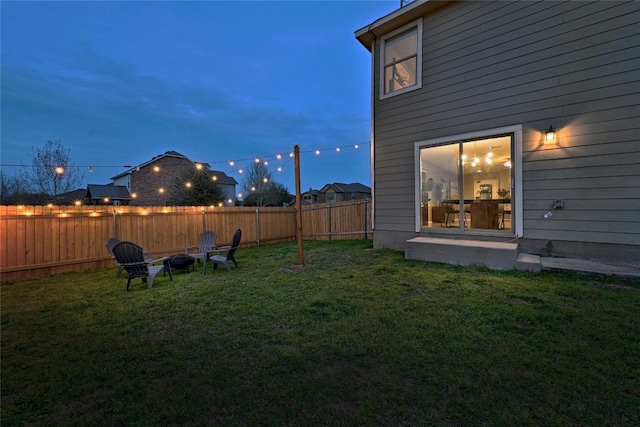 view of yard at dusk