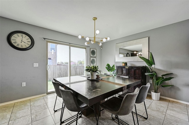 tiled dining space featuring an inviting chandelier