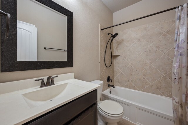 full bathroom featuring shower / tub combo with curtain, vanity, and toilet