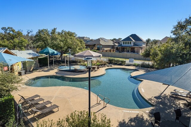 view of swimming pool with a patio