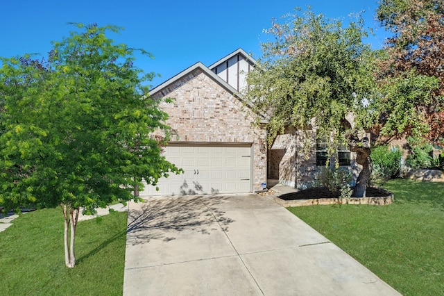 view of property hidden behind natural elements with a garage and a front yard