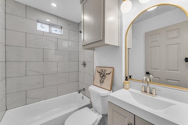 bathroom featuring recessed lighting, vanity, shower / bathing tub combination, and toilet