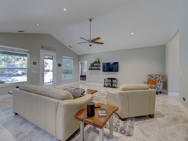 living room with ceiling fan and lofted ceiling