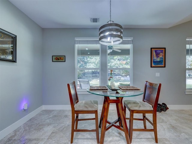 dining space featuring a chandelier