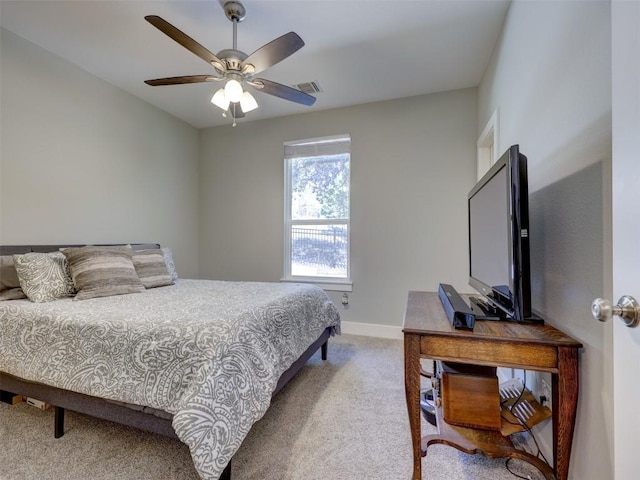 carpeted bedroom featuring ceiling fan