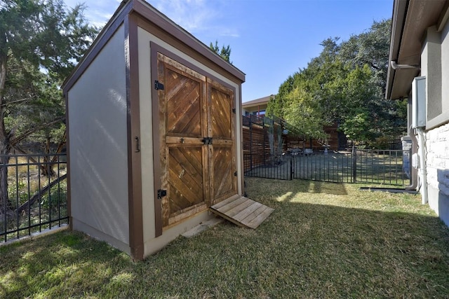 view of outdoor structure with a lawn