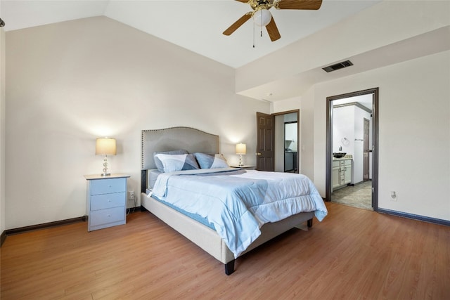 bedroom featuring ceiling fan, vaulted ceiling, and light wood-type flooring